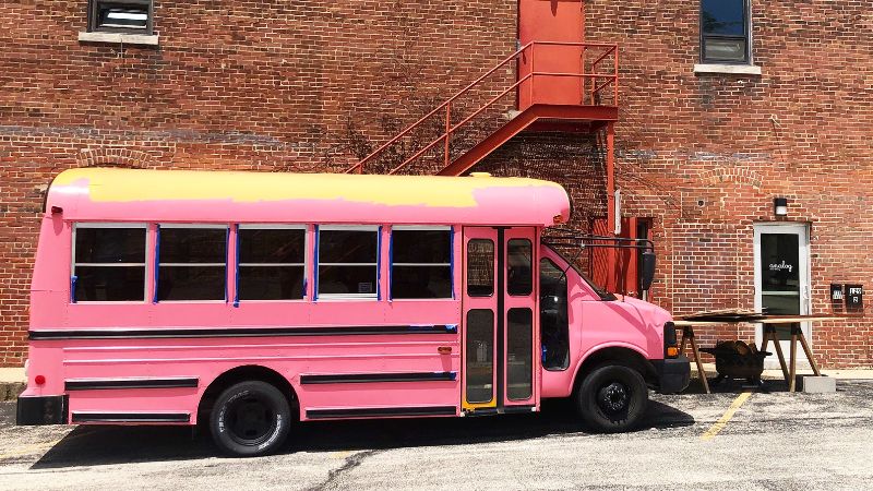There’s a cute bus in front of Analog