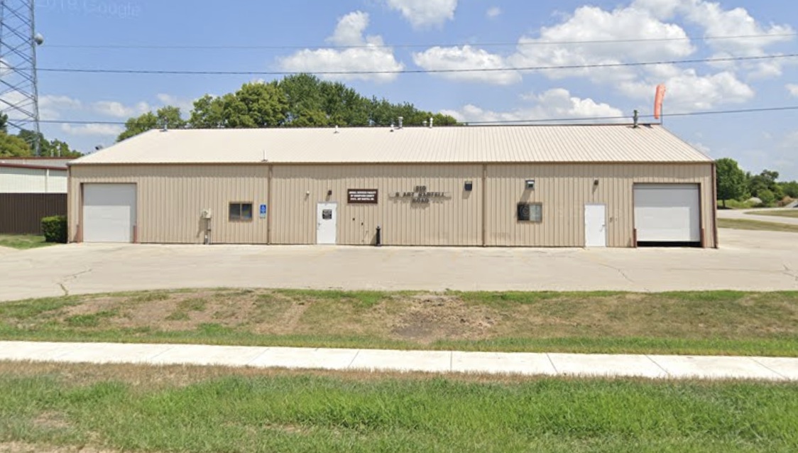 Exterior view of Champaign County Animal Control. A non-descript, beige, one story building.