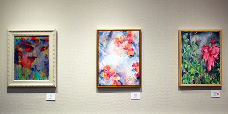 Three of Percoco's floral paintings.