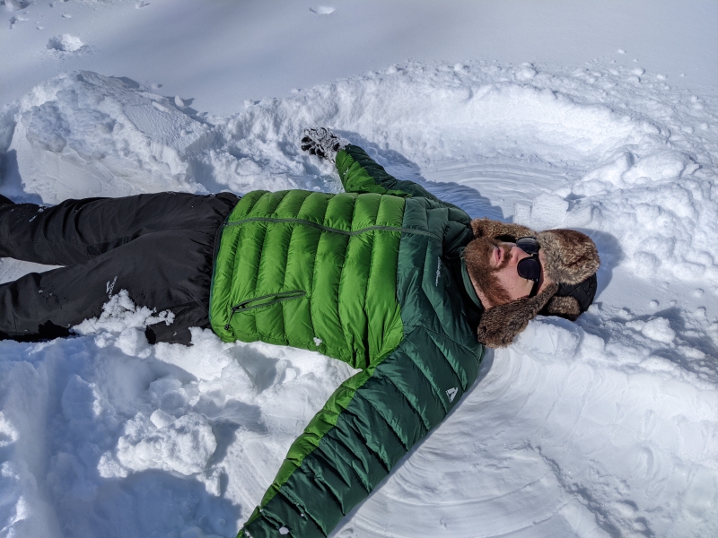 A close up of the author laying in the snow. Photo by Andrea Black.