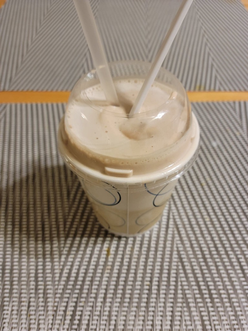 Cold fudge shake with a spoon and straw sticking out of it. Photo by Matthew Macomber.