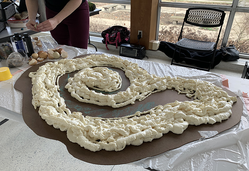 Artist Sierra Shaw Murphy begins prep for her work with an egg-based foam. 