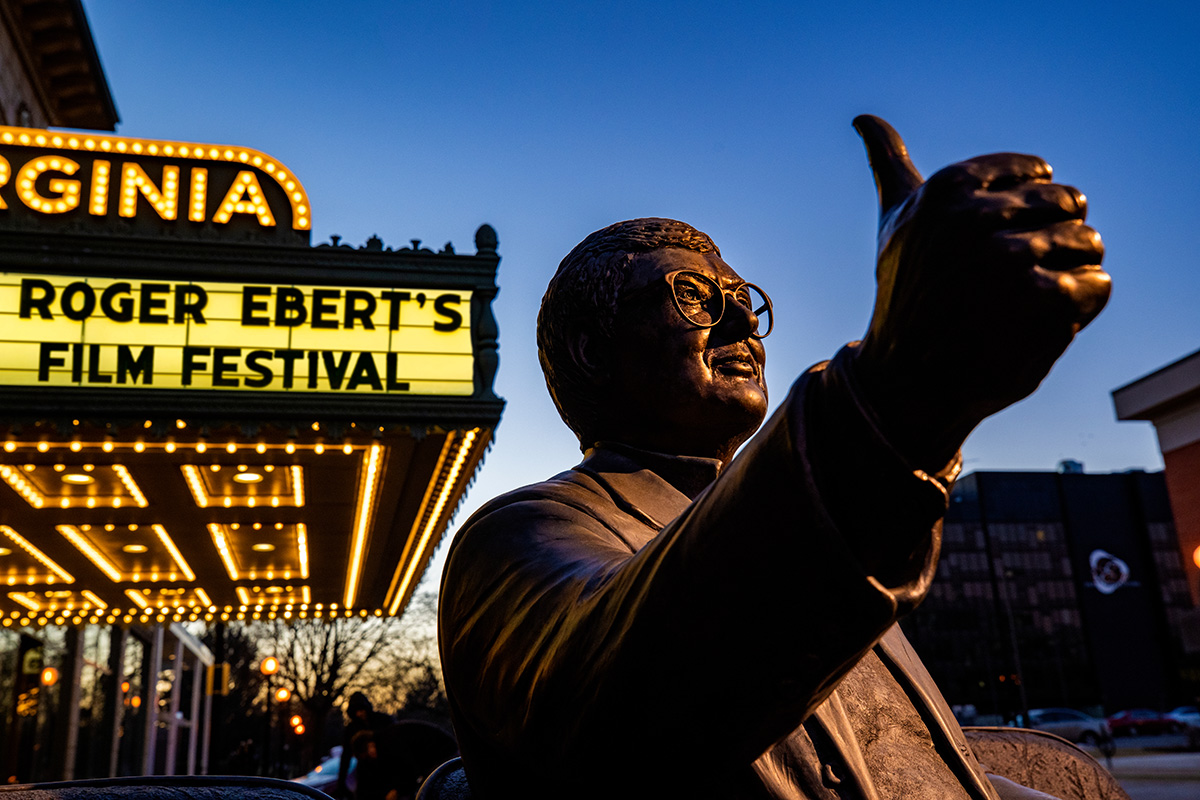 A statue of Roger Ebert giving a “Thumbs Up” sits outside of the Virginia Theatre,