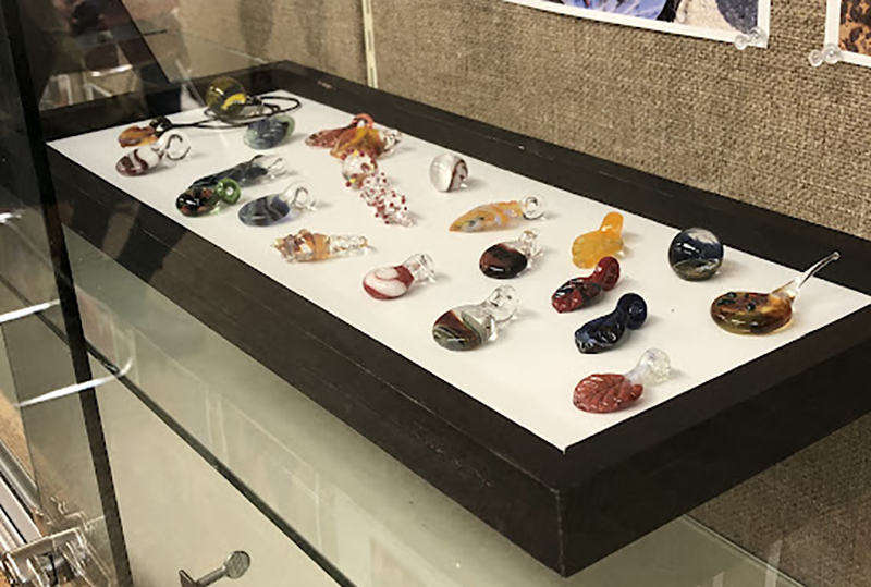 Selection of glass creations from the D.R.E.A.A.M. project at the Urbana Free Library.