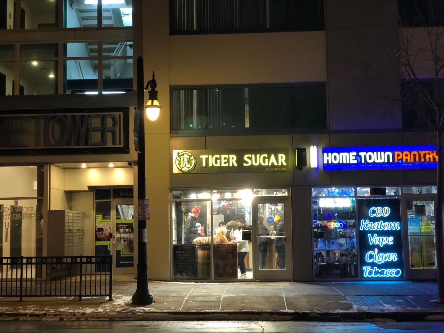 Across the street, there is Tiger Sugar and Hometown Pantry on Green Street at night. Photo by Xiaohui Zhang.