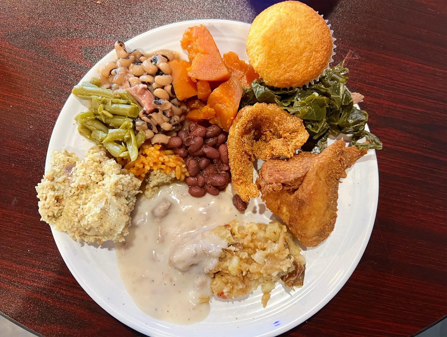 The author's second plate of food with less food than the first plate, but still featuring small scoops of the buffet. Photo by Alyssa Buckley.
