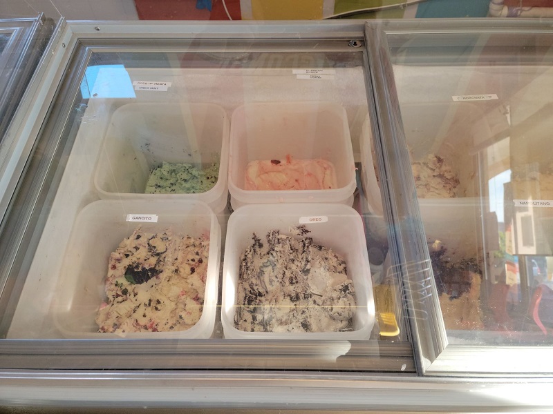 A display case of dairy-based ice cream with Oreo, Gancito, and Oreo mint ice cream seen most clearly. Photo by Matthew Macomber.