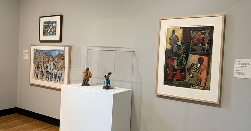 A wide view of collages and paper mache sculptures by Allen Stringfellow at Krannert Art Museum.