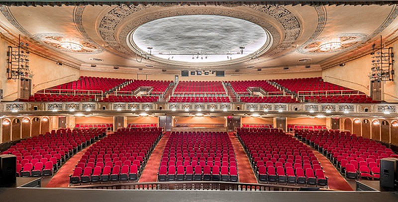 The empty virginia theatre with red seats and a balcony