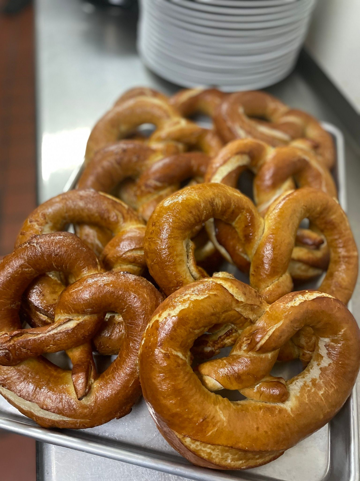 Many made-from-scratch pretzels are stacked in a metal pan in the kitchen of Horsch Radish. Photo from Horsch Radish's Facebook page.