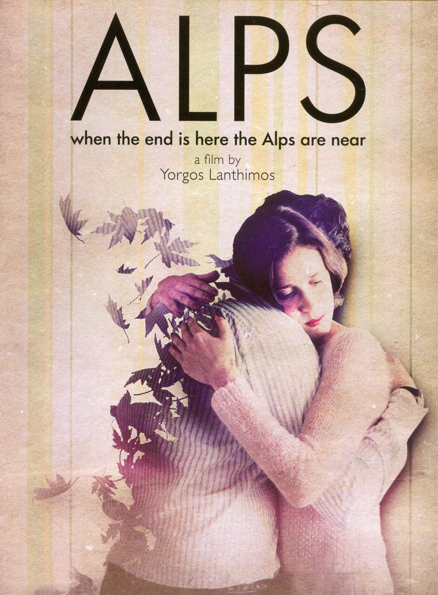  A movie poster for the film Alps depicting a couple hugging; the male figure appears to be deteriorating and pieces of his body are blowing away in the wind; the flying pieces look like autumn leaves. Photo courtesy of Criterion Channel.