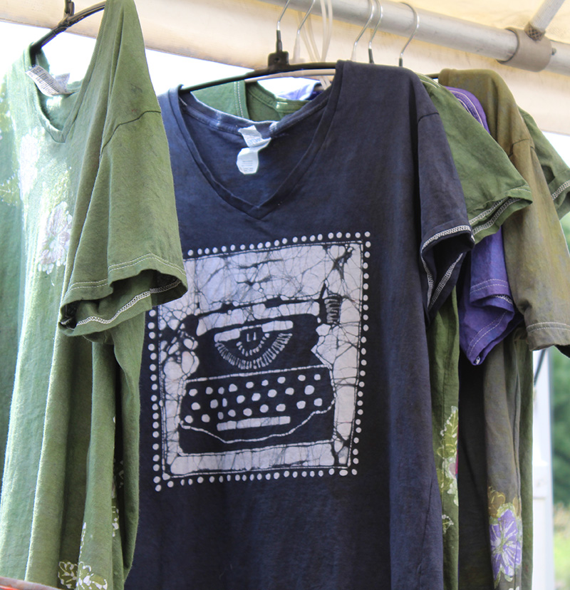 Batik t-shirts with center black one featuring a typewriter design.