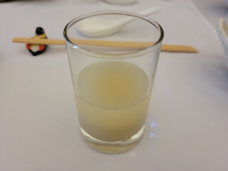Makgeolli alcohol in a small glass. Photo by Matthew Macomber.