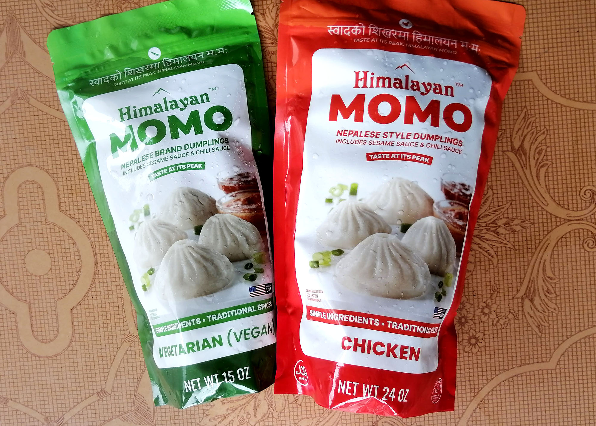 Two frozen food packages labeled â€œHimalayan Momoâ€; one is labeled â€œvegetarianâ€ and the other is labeled â€œchicken.â€ Photo by Paul Young.