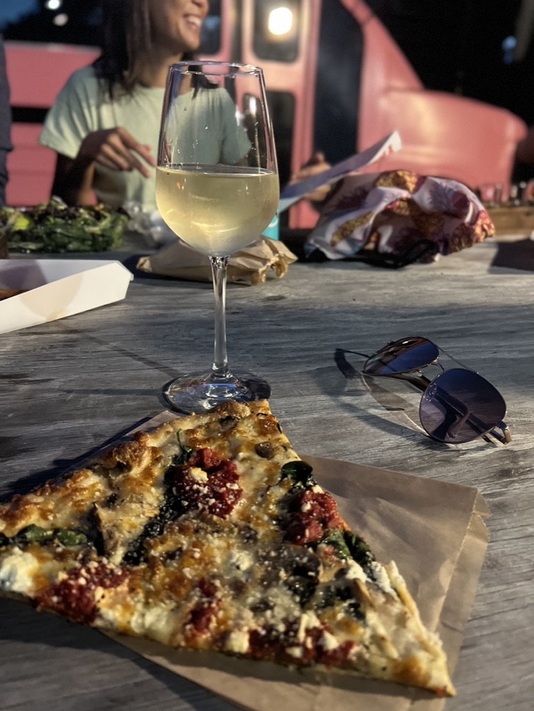 Pesto Pizza from Manolos pairs perfectly with the Cabert Pinot Grigio from Analog. A flight of wine for $19 Photo by Rashmi Tenneti.
