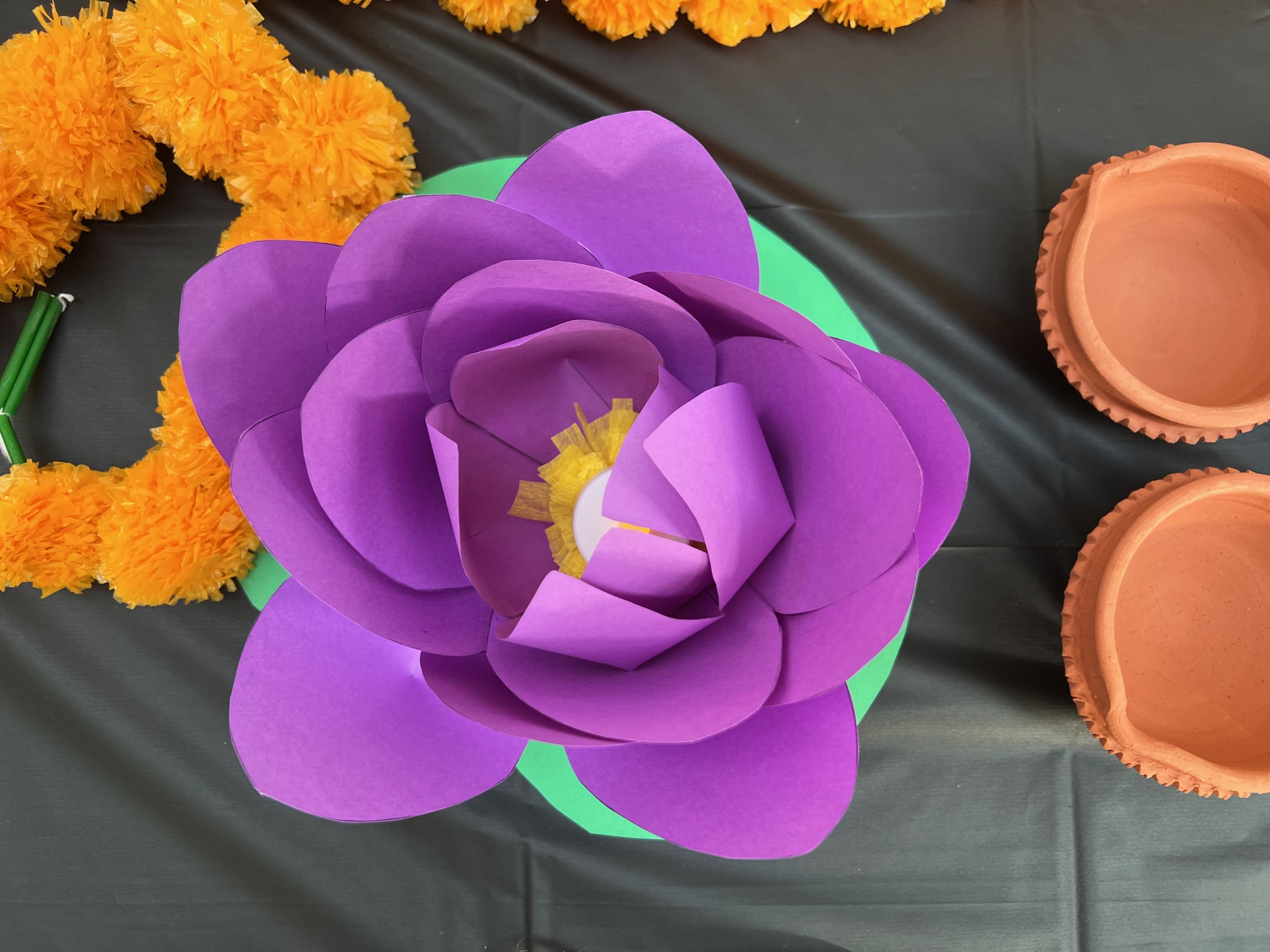 At the India table, there is a purple paper flower. Photo by Alyssa Buckley.