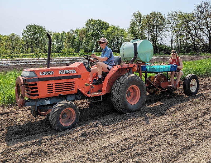 Meyer Produce's Molly Oberg is operating a tractor on her farm. Photo by Meyer Produce.
