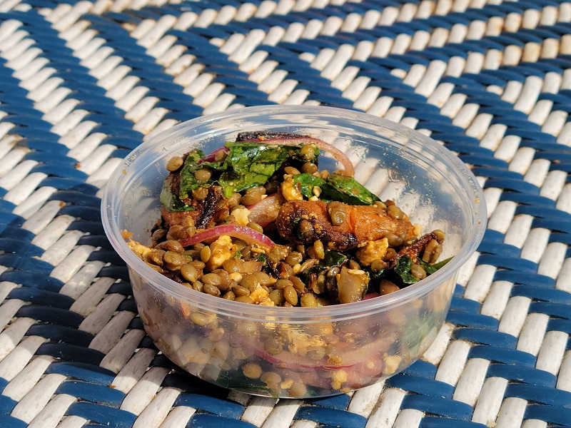 Sweet potato lentil salad in a small plastic cup. Photo by Matthew Macomber.