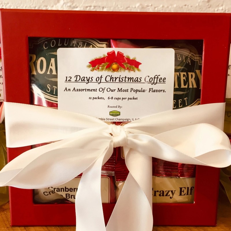 A red box with a clear pane in front and a sticker that says 12 Days of Christmas Coffee. It's tied with a big white bow. Photo from Columbia Street Roastery website.