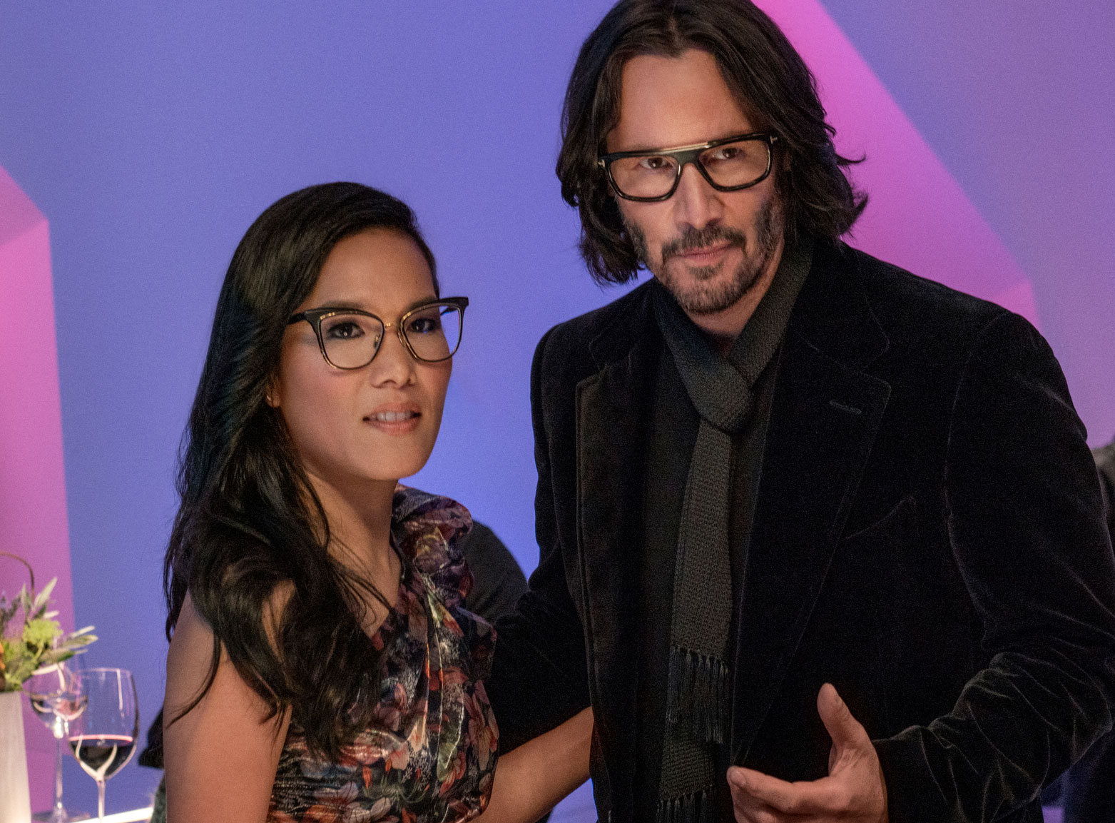 A still from the film Always Be My Maybe: Ali Wong and Keanu Reeves play a well-dressed couple on a date at a fancy restaurant. Photo by Netflix.