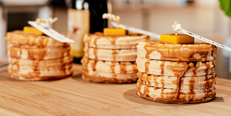 Three stacks of candles resembling stacks of pancakes. Photo by V Mullen Media.