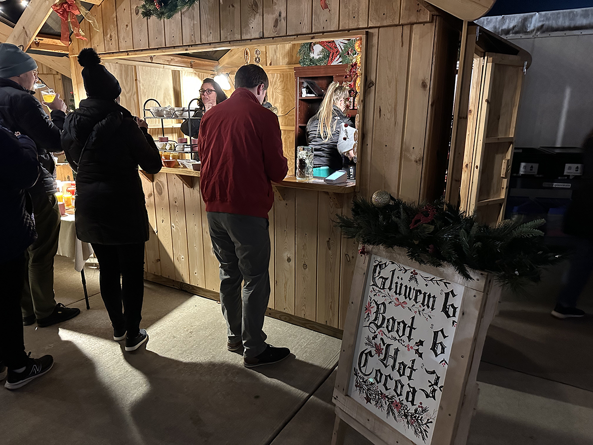 A sign at Riggs Beer Company's Christmas Market advertising mulled wine and hot cocoa. Photo by Jake Williams. 