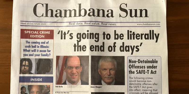 A copy of the fake newspaper the Chambana Sun sits on a table. The headline reads 