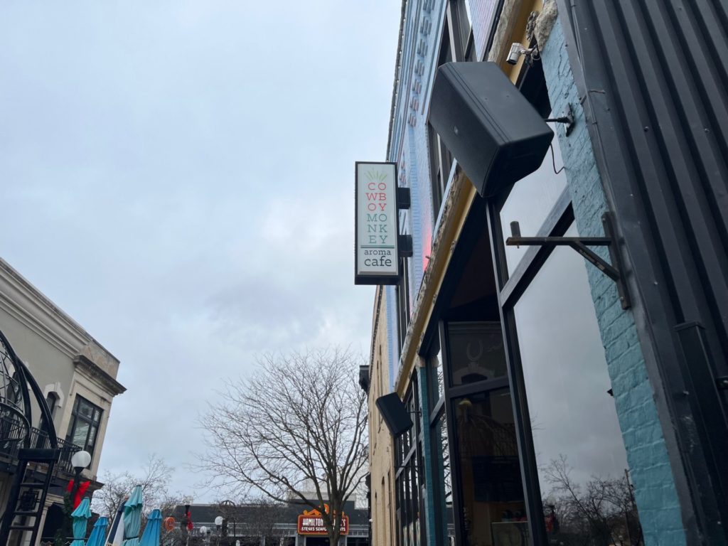 The exterior of Aroma Cafe/Cowboy Monkey in Downtown Champaign on a cloudy January morning. Photo by Alyssa Buckley.