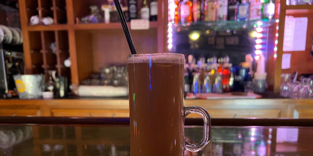 A hot buttered rum from Bentley's Pub in Champaign, Illinois is on the bar. Photo by Alyssa Buckley.