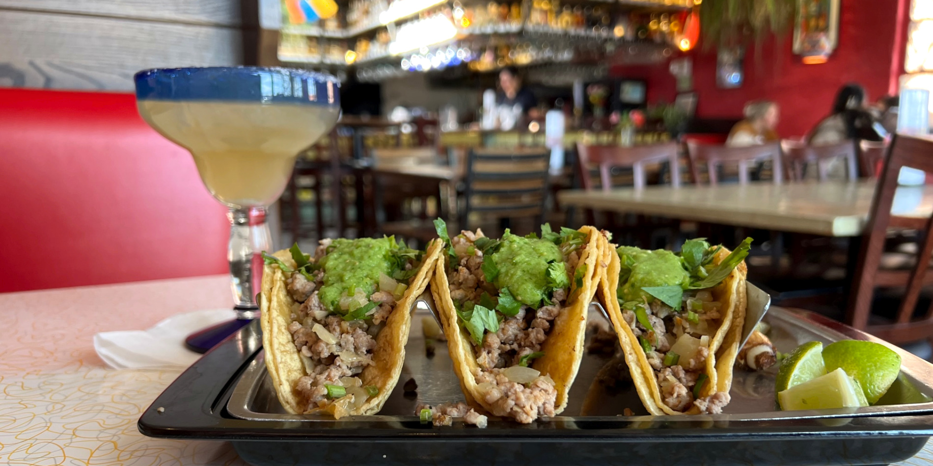 Three Alex tacos with a margarita sit on a table inside Fiesta Cafe in Champaign. Photo by Alyssa Buckley.