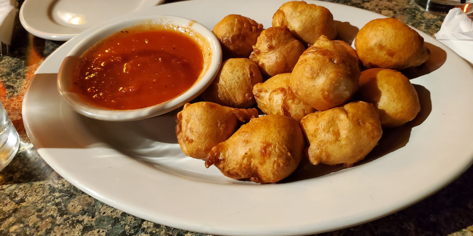 A cropped photo of the appetizer cheese curds at Seven Saints in Champaign. Photo by Carl Busch.