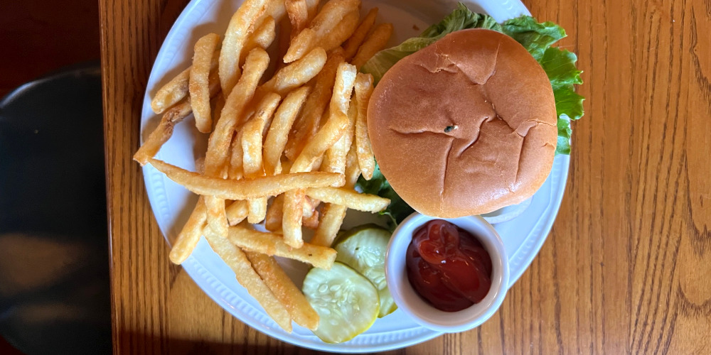 An overhead photo of a burger with fries at Silvercreek in Urbana for Restaurant Week. Photo by Alyssa Buckley.