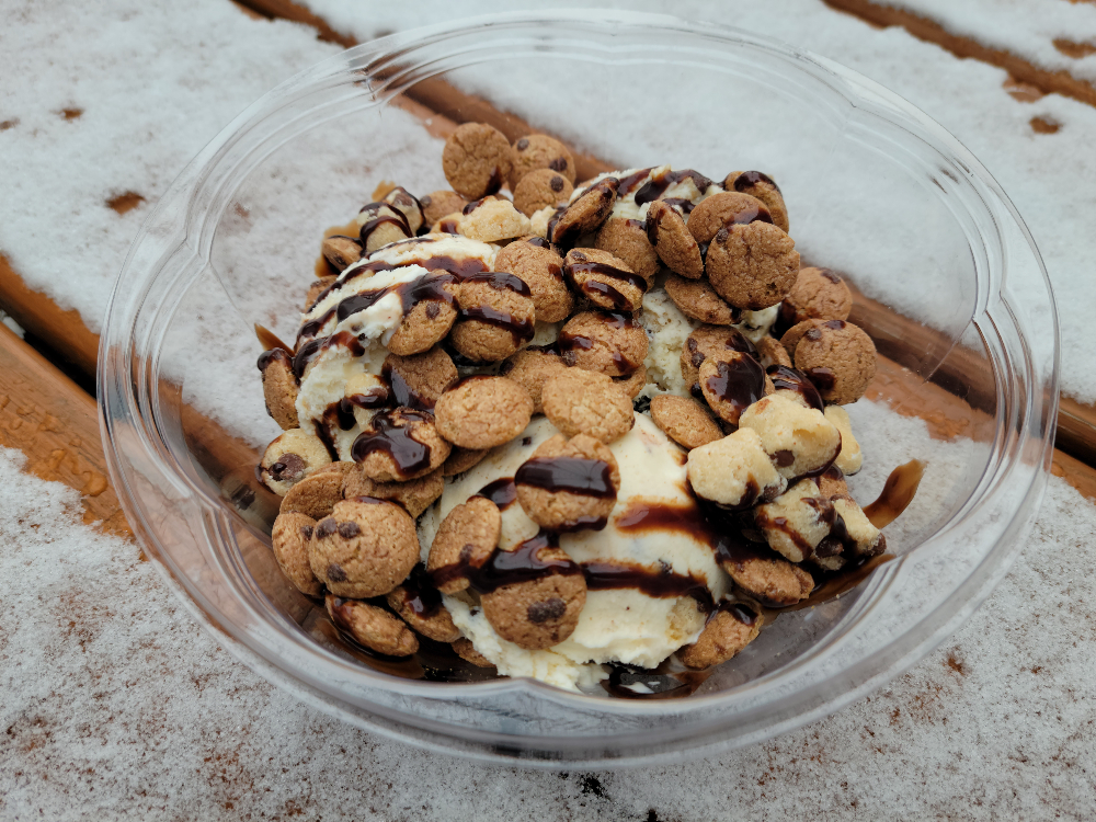A large, plastic bowl of Heavy Cookie Dough on a table outside. Photo by Matthew Macomber.