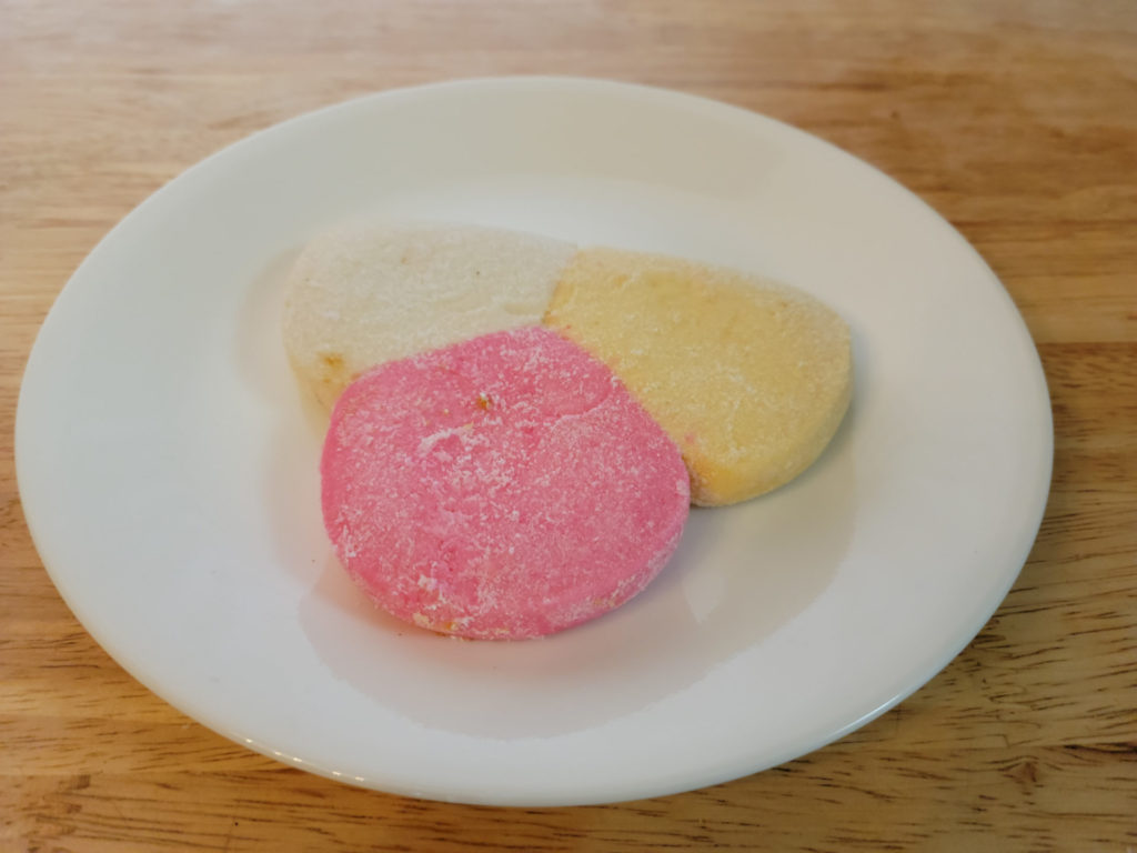 A pink, yellow, and white sugar cookie. Photo by Matthew Macomber.