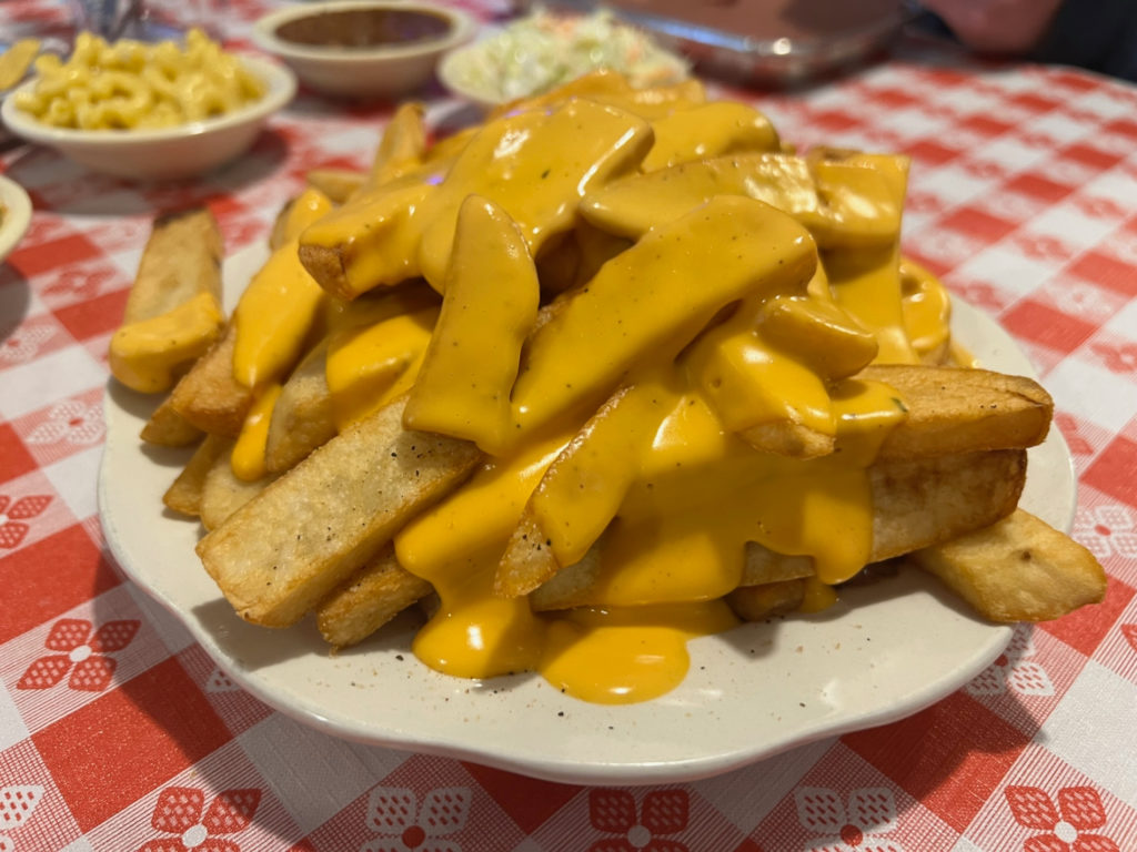 An order of the brisket horseshoe at Smoky's House BBQ has a mound of steak fries covered in an orange-yellow cheese sauce. Photo by Alyssa Buckley.