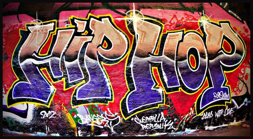 Graffiti on a wall that says the words "Hip Hop".