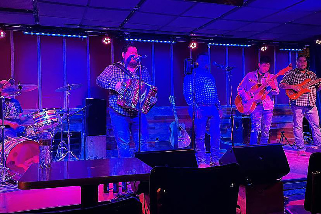 5 members of the band Los Texano'z playing onstage at Rose Bowl Tavern.