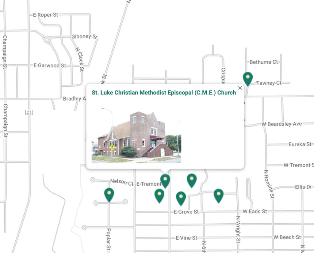 A street level map with several green markers scattered across it. Next to one marker is a photo of a brown brick church on a street corner.