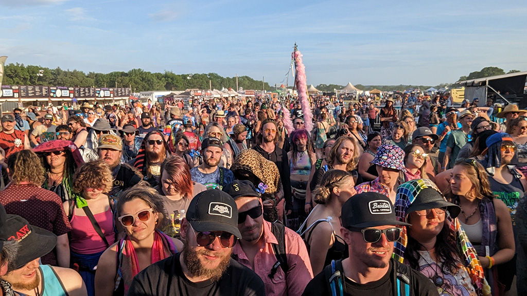 Shot of a large crowd taken from the front of the stage at an outdoor music festival