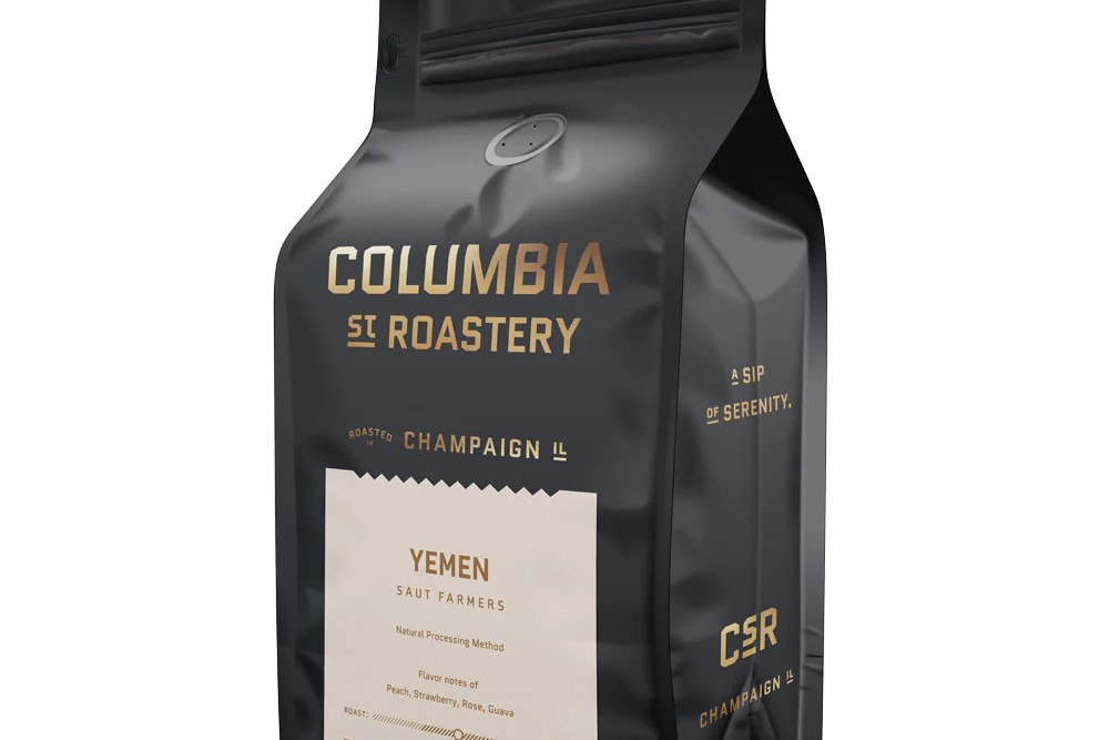 A black package with gold lettering that says Columbia Street Roastery. It has a cream colored label on the front that says Yemen in smaller gold lettering.