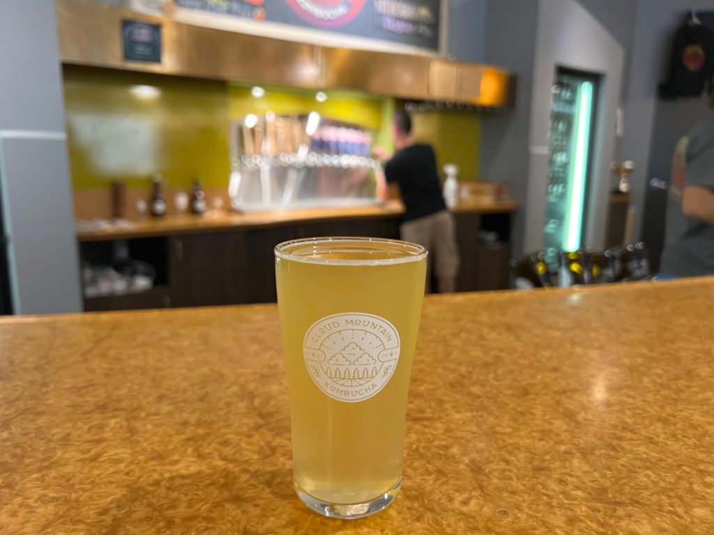 On the bar, there is a half pint of lime leaf and mint kombucha by Cloud Mountain Kombucha for a mocktail making class. Photo by Alyssa Buckley.