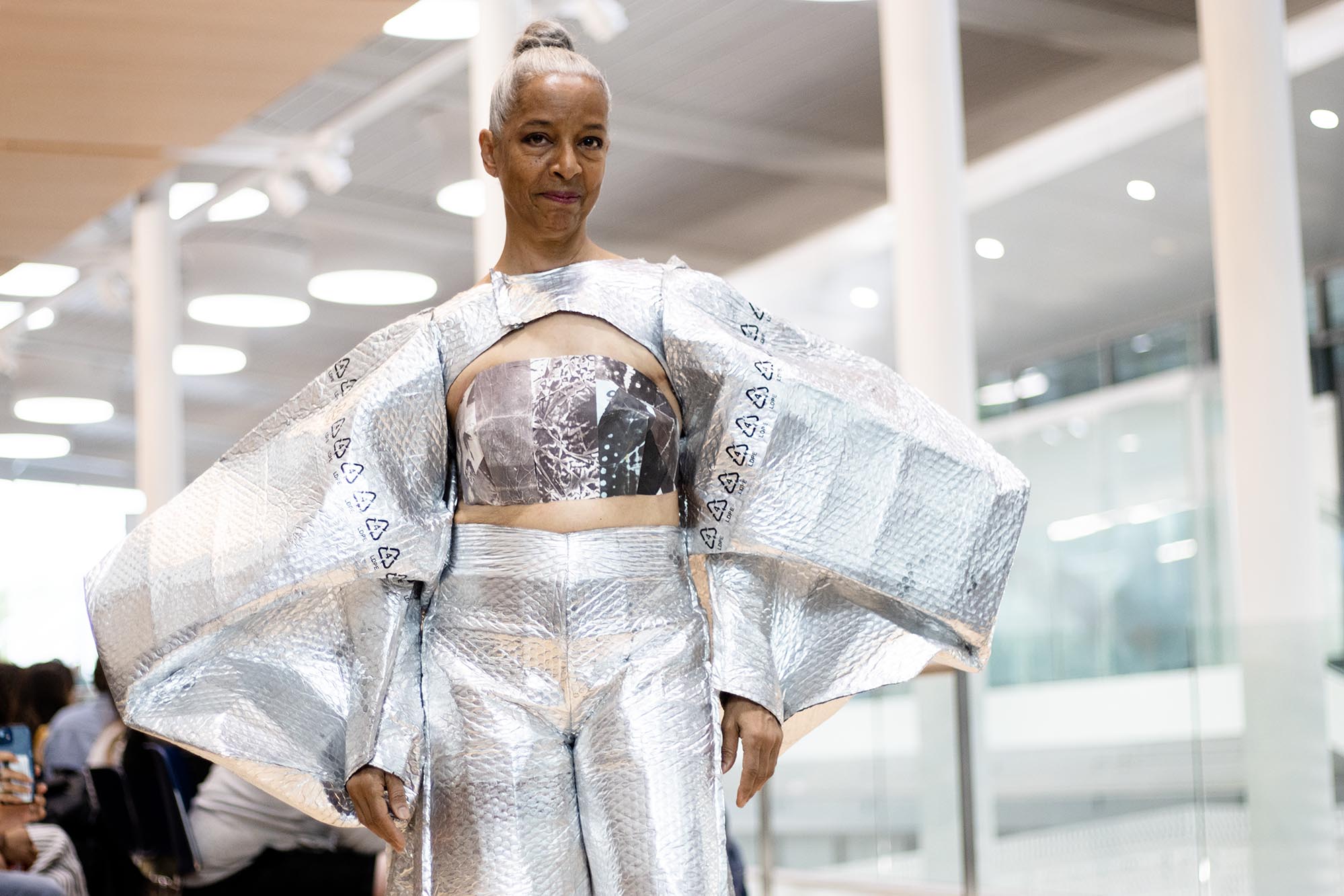 Re-Fashioned 2023. Model Roxane D’Orrleans Juste wears an outfit fashioned out of bubble wrap and packing materials. Designed by Natalia Espinel-Porras and Kelsea Andrade.