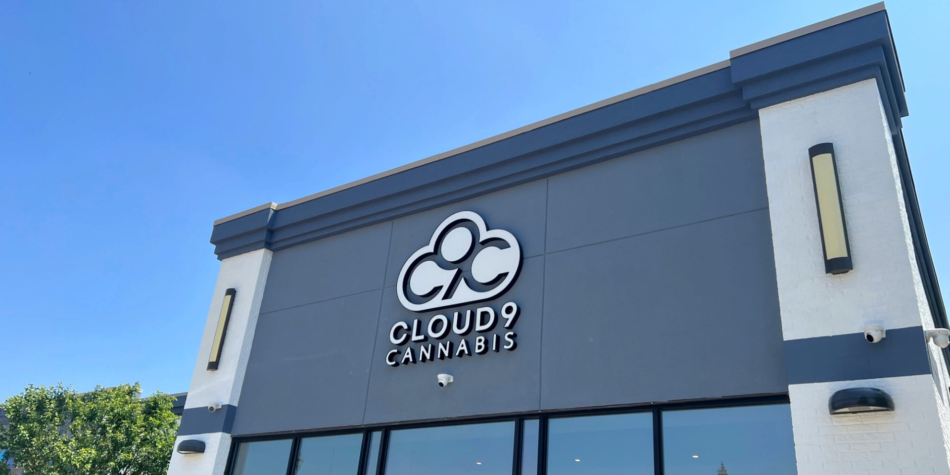 A cropped photo of Cloud9 cannabis dispensary in Champaign on a sunny day with a blue sky. Photo by Alyssa Buckley.