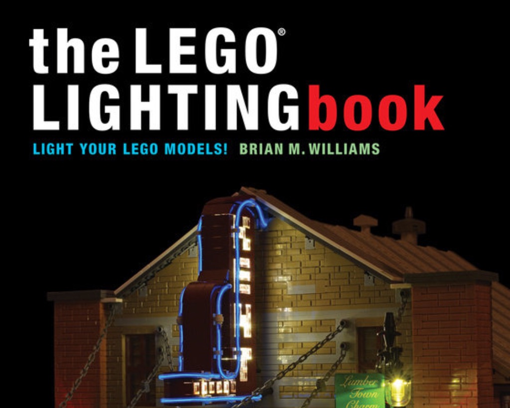 The cover of the LEGO lighting book in white and red text. There is a theater building built out of LEGOs.