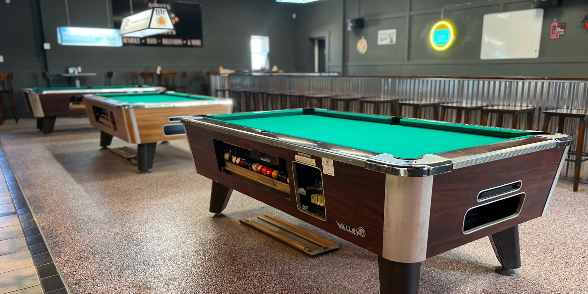 Shots N Slots in Urbana has three pool tables inside a simple bar. Photo by Alyssa Buckley.