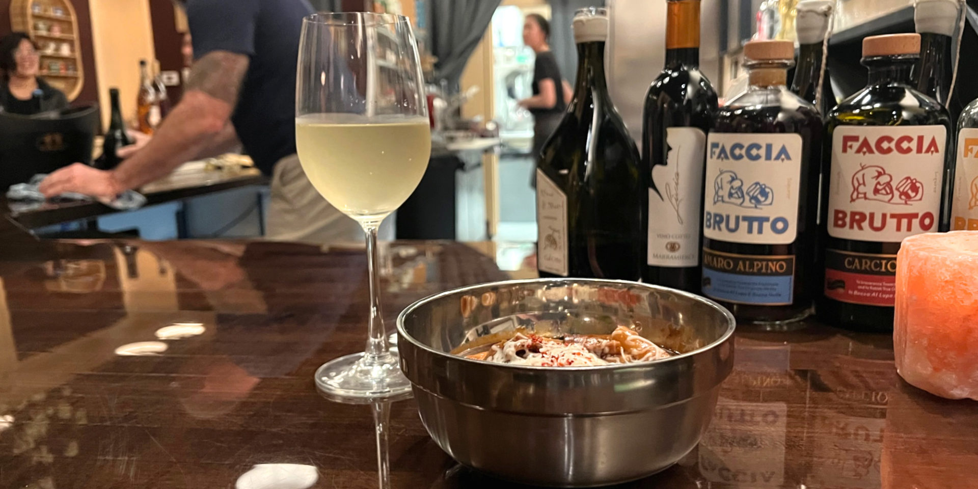A dish and petit wine as part of Alice's Diner experience inside Ladro Enoteca. Photo by Alyssa Buckley.