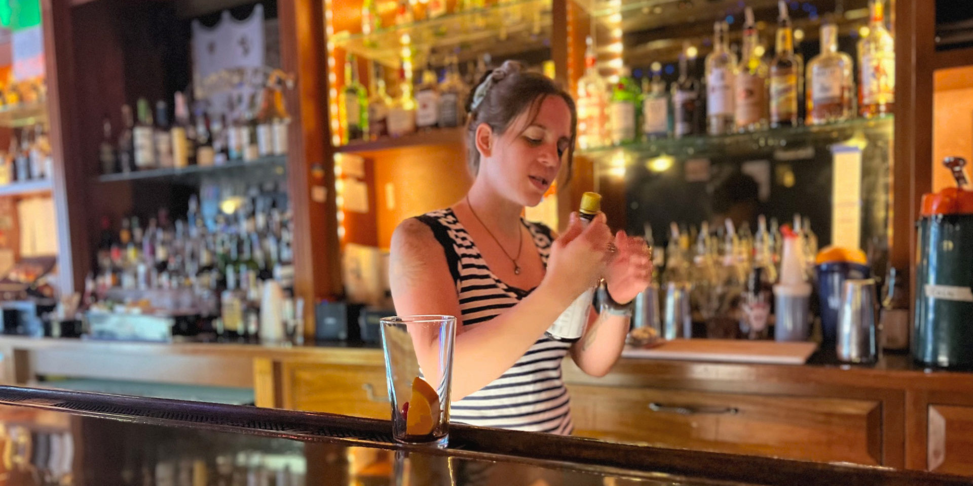 A cropped image of Katie Carrillo working the bar at Bentley's Pub in Champaign. Photo by Alyssa Buckley.