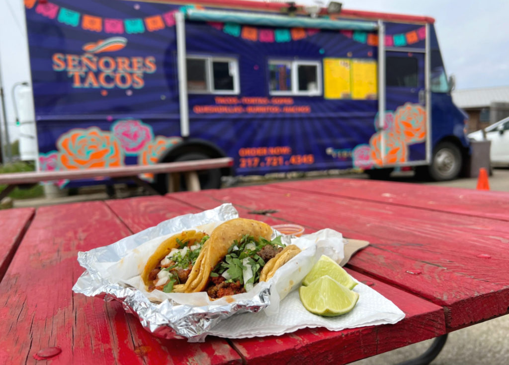 Senores Tacos on a red patio table in a list of Champaign-Urbana food trucks