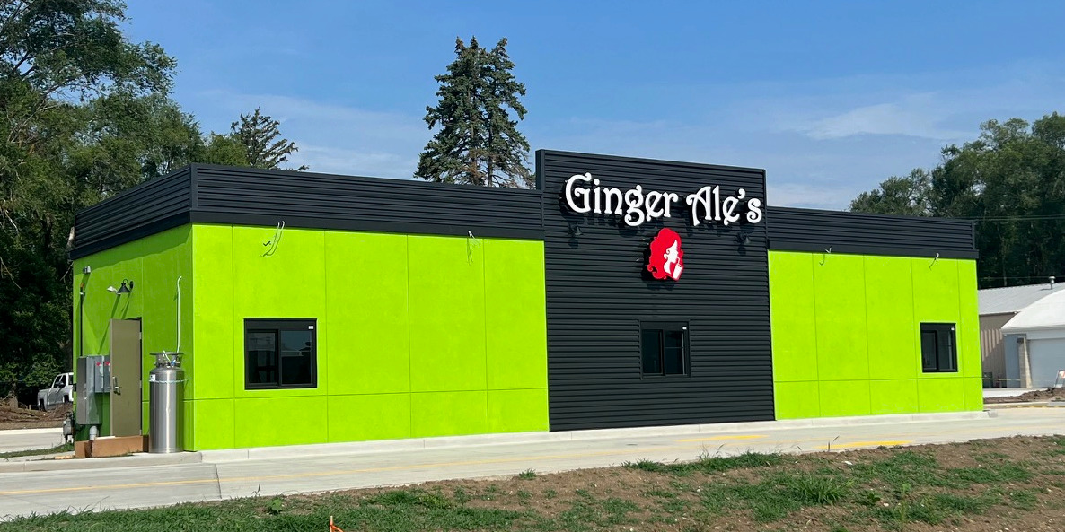 Ginger Ale's in Savoy is near completion. The outside is lime green with a center accent of black with the red logo and text of "Ginger Ale's" above it. Photo by Alyssa Buckley.