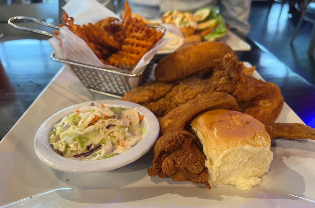 A plate of delicious fried chicken and catfish from Neil St. Blues. Photo by Alyssa Buckley.